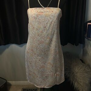 Cream and pink silk slip dress with adjustable straps and a floral pattern